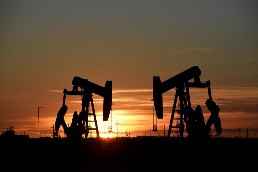 Representational image: Pump jacks operate at sunset in an oilfield in Midland, Texas U.S. August 22, 2018. — Reuters/Files
