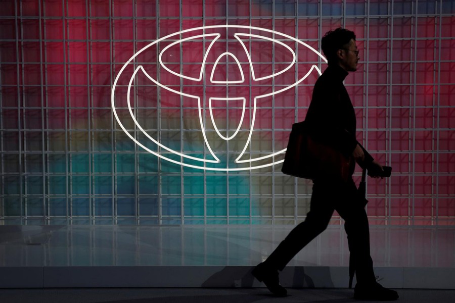 A man walks past a Toyota logo at the Tokyo Motor Show, in Tokyo, Japan on October 24, 2019 — Reuters/Files