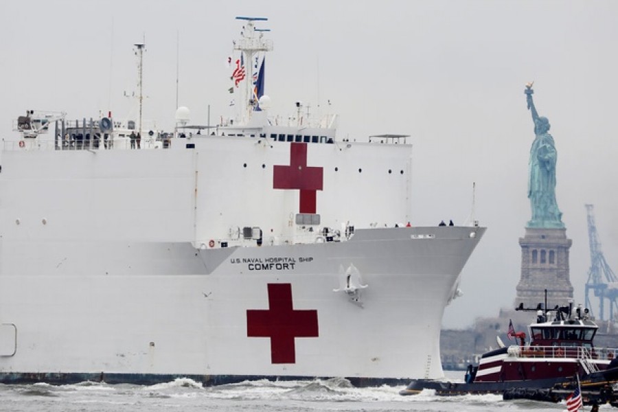 The USNS Comfort passes the Statue of Liberty as it enters New York Harbor during the outbreak of the coronavirus disease (COVID-19) in New York City, US, March 30, 2020. — Reuters