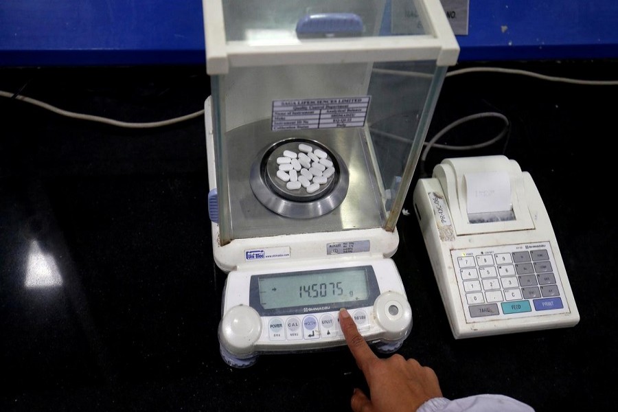A pharmacist checks weight of Paracetamol, a common pain reliever also sold as acetaminophen, tablets inside a lab of a pharmaceutical company on the outskirts of Ahmedabad, India, March 04, 2020. — Reuters/Files