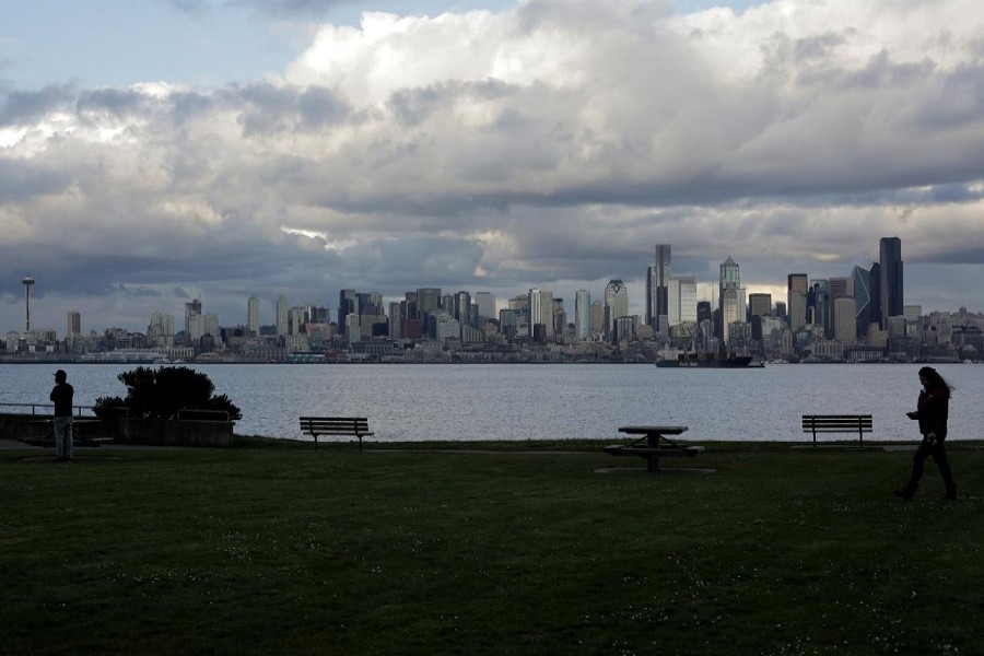 People practice social distancing while spending time outdoors in the West Seattle neighborhood during the coronavirus disease (COVID-19) outbreak in Seattle, Washington, US, April 02, 2020. — Reuters