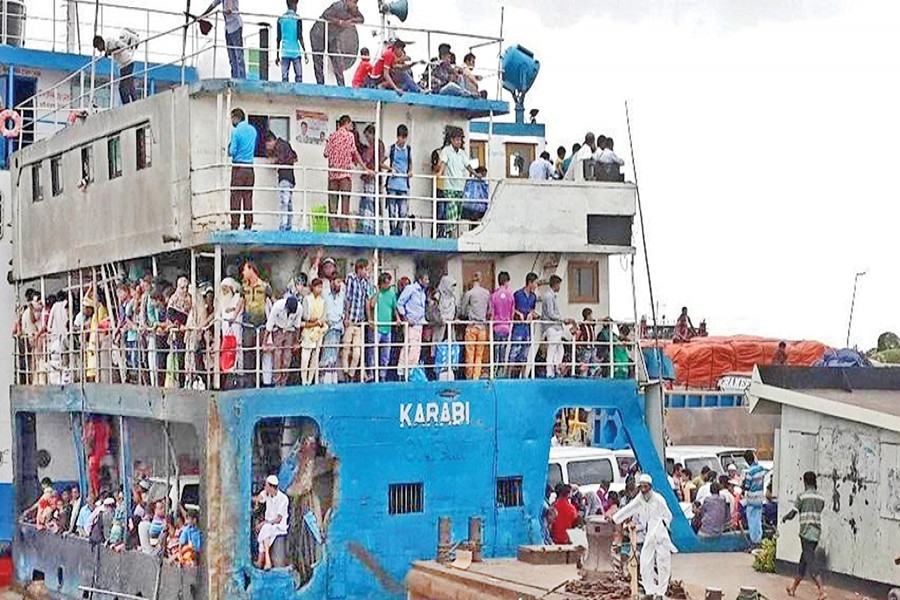 A large number of people, heading for Dhaka to resume their duties, seen on board a ferry at Mawa Ghat on Saturday — Focus Bangla