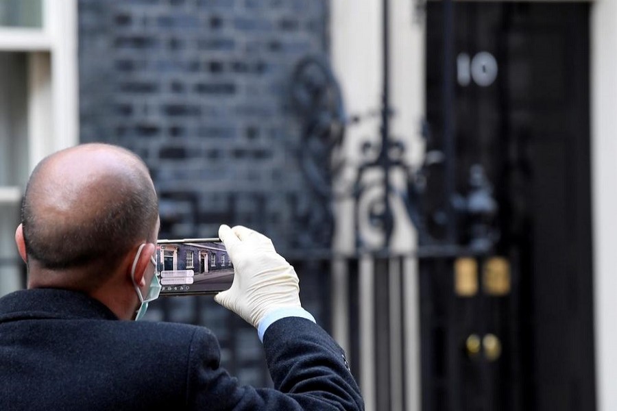 A journalist is pictured filming the front of 10 Downing street after Britain's prime minister Boris Johnson tested positive for the coronavirus disease (COVID-19), in London, Britain, March 27, 2020. —  Reuters/Files