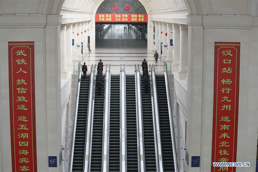 Police officers patrol Hankou Railway Station in Wuhan, central China's Hubei Province, April 06, 2020.