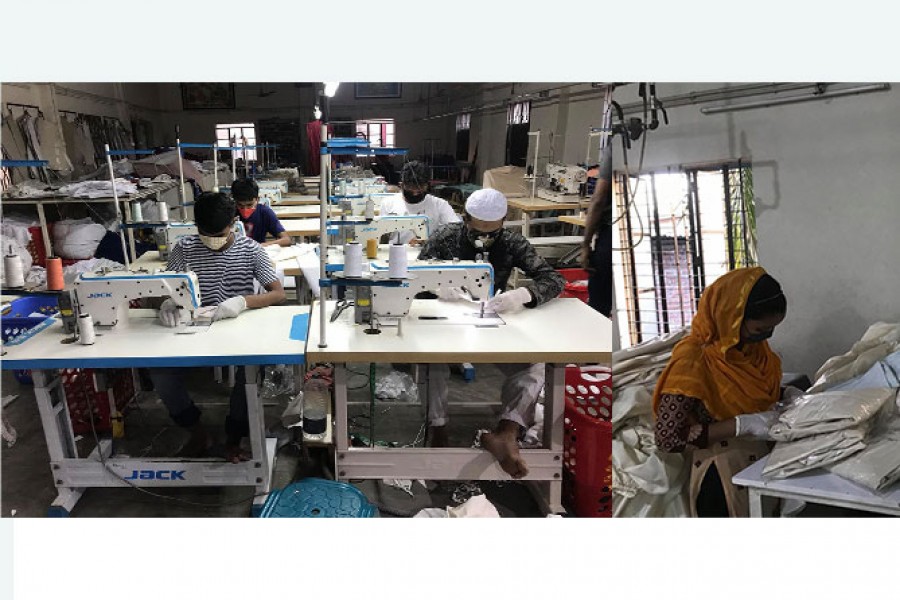 Workers are engrossed in making PPE at Fiber Fashion in Gazipur recently
