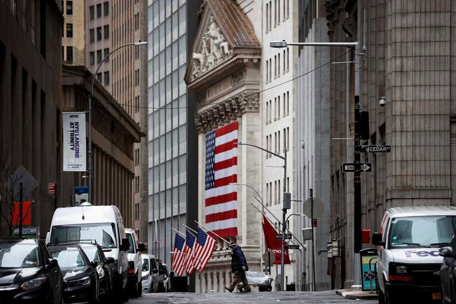 A man crosses a nearly deserted Nassau Street in front of the New York Stock Exchange (NYSE) in the financial district of lower Manhattan during the outbreak of the coronavirus disease (Covid-19) in New York City, New York, US on April 03, 2020. 	-—Photo: Reuters