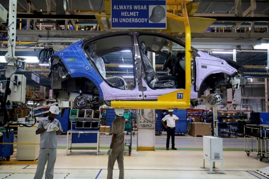 Workers assemble a Tata Tigor car inside the Tata Motors car plant in Sanand, on the outskirts of Ahmedabad, India, Aug 7, 2018. REUTERS