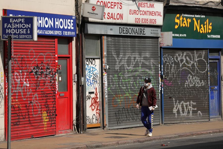 Photo taken on April 13, 2020 shows a general view of closed business premises on New Cross Road in London, Britain. (Photo by Tim Ireland/Xinhua)