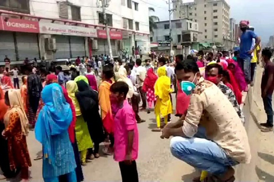 Workers from a readymade garment factory in Gazipur take to the streets on Sunday seeking payment of their dues amid the nationwide lockdown — UNB photo