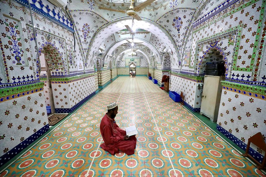 A Muslim devotee recites the Qur'an at the Star Mosque during Ramadan in Dhaka, Bangladesh on April 26, 2020 — Reuters photo