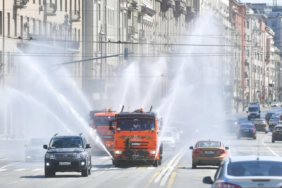 Vehicles spray disinfectant while sanitizing a road amid the outbreak of the coronavirus disease (COVID-19) in Moscow, Russia May 1, 2020. Sergei Kiselyov/Moscow News Agency/Handout via REUTERS