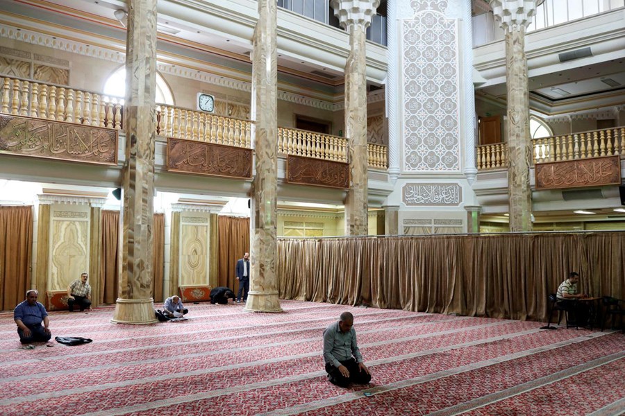 Worshippers pray as they keep social distancing at a mosque following the outbreak of the coronavirus disease (COVID-19), in Tehran, Iran on April 30, 2020 — WANA via Reuters