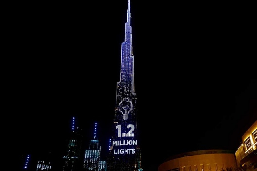 Dubai's Burj Khalifa, the world's tallest building, lit its 1.2 million lights to become the world's tallest donation box to buy meals for people hit by the impact of the new coronavirus disease (COVID-19) pandemic in Dubai, United Arab Emirates May 11, 2020. REUTERS