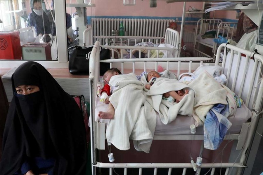 Newborn children who lost their mothers during yesterday's attack lie on a bed at a hospital, in Kabul, Afghanistan, May 13, 2020. — Reuters