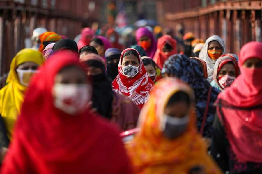 Garment workers returning from a workplace as factories reopened after the government has eased the restrictions amid concerns over the coronavirus disease (COVID-19) outbreak in Dhaka, Bangladesh, May 4, 2020. –Reuters Photo