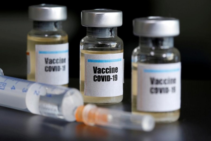 Small bottles labeled with a "Vaccine COVID-19" sticker and a medical syringe are seen in this illustration taken April 10, 2020. — Reuters/Files