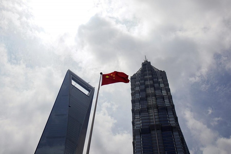 A Chinese flag is pictured at Lujiazui financial district in Pudong, Shanghai, China, May 22, 2020. — Reuters