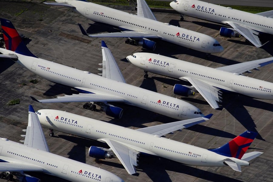 Delta Air Lines passenger planes are seen parked due to flight reductions made to slow the spread of coronavirus disease (COVID-19), at Birmingham-Shuttlesworth International Airport in Birmingham, Alabama, US March 25, 2020. REUTERS/Elijah Nouvelage