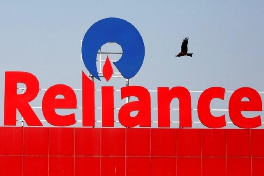 A bird flies past a Reliance Industries logo installed on its mart in Ahmedabad, India, January 16, 2017. — Reuters/Files