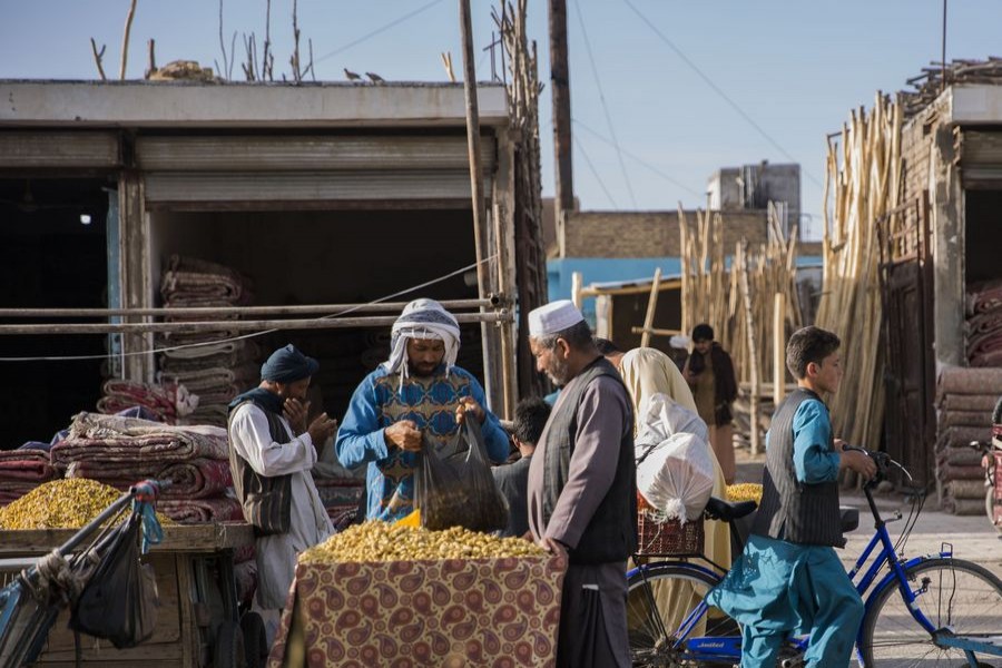 Afghans buy dry fruits ahead of Eid al-Fitr festival in Herat, Afghanistan, May 20, 2020. Many Afghans prepare for the upcoming Eid al-Fitr festival, which marks the end of the fasting month of Ramadan. (Photo by Elaha Sahel/Xinhua)