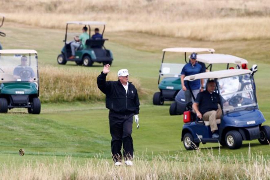 US President Donald Trump gestures as he walks on the course of a golf resort — Reuters file photo used for representation