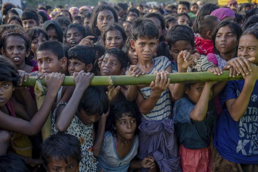 Representational image: In this September 25, 2017, file photo, Rohingya Muslim children, who crossed over from Myanmar into Bangladesh, wait to receive handouts near Balukhali refugee camp, Bangladesh. — AP
