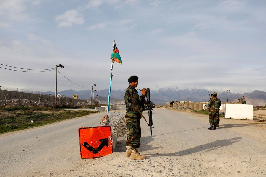 An Afghan National Army (ANA) soldier stands guard at a checkpoint outside Bagram prison, north of Kabul, Afghanistan on April 8, 2020 — Reuters/Files
