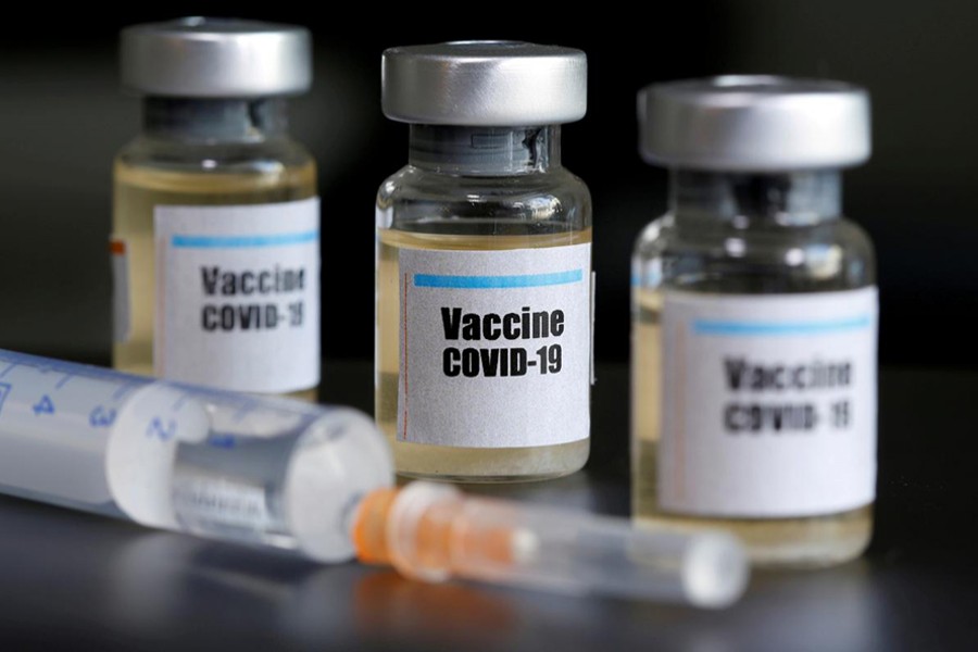 Small bottles labelled with a "Vaccine COVID-19" sticker and a medical syringe are seen in this illustration taken on April 10, 2020 — Reuters/Files