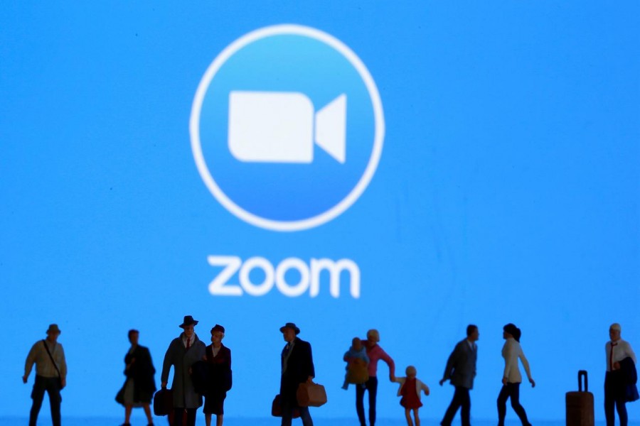 Small toy figures are seen in front of diplayed Zoom logo in this illustration taken on March 19, 2020 — Reuters/Files