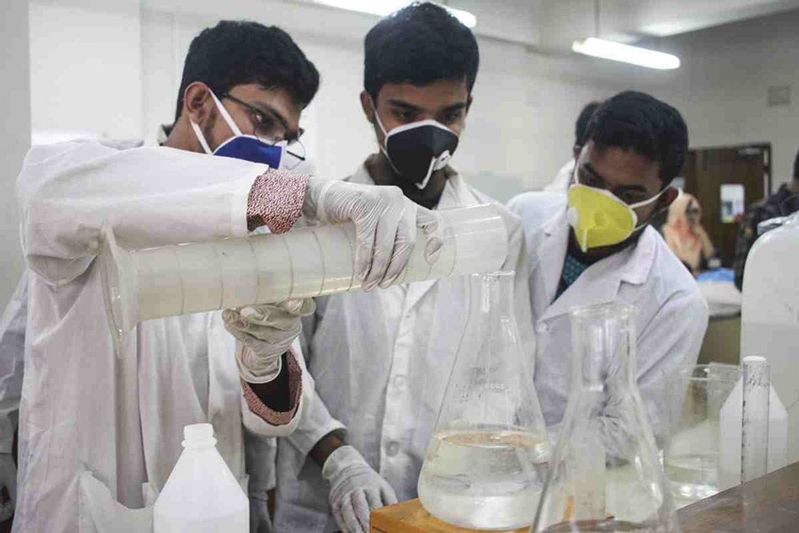 Students and teachers of Dhaka University prepare low-cost hand sanitiser —UNB Photo