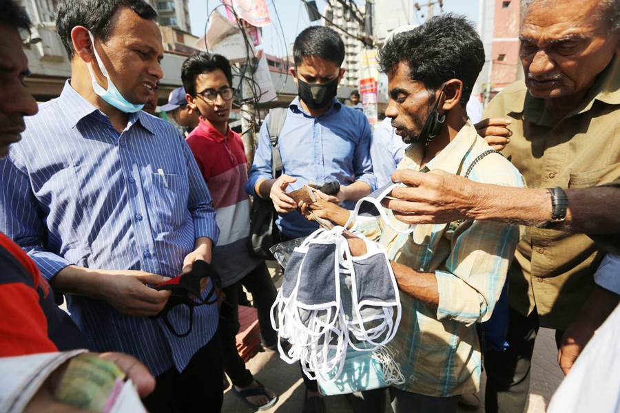 A brisk trade in face masks on the streets of Dhaka	- AL JAZEERA PHOTO