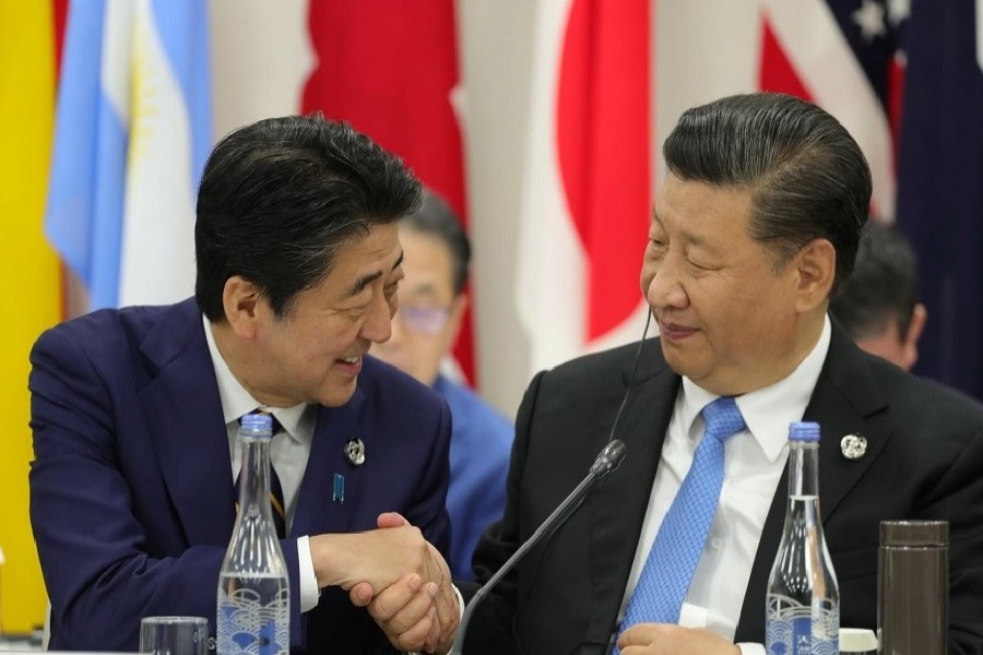 Japan's Prime Minister Shinzo Abe shakes hands with China’s President Xi Jinping during the G20 summit in Osaka, Japan, June 28, 2019. — Reuters/Files