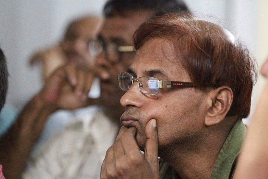 Investors monitoring stock price movements on computer screens at a brockerage house in Dhaka city. — FE/Files