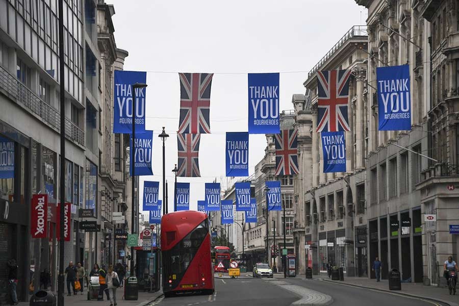 Union flags and support messages are seen in the shopping street, Oxford Street, ahead of the reopening of the non-essential businesses from Monday -AP Photo