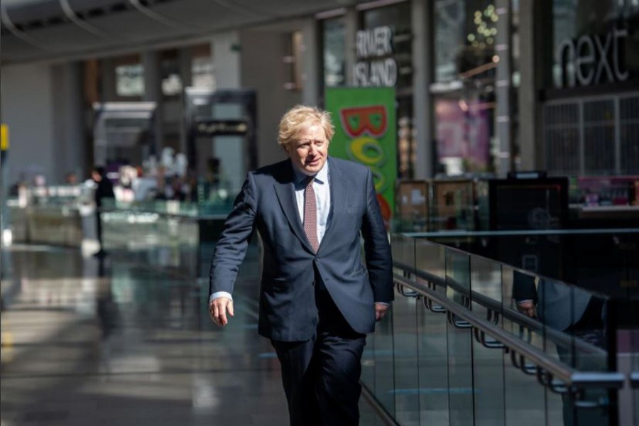 Prime Minister Boris Johnson visits the M&S clothing department and other retail outlets in Westfield Stratford to see the COVID-19 measure taken before reopening tomorrow, in London, Britain June 14, 2020. John Nguyen/Pool via REUTERS