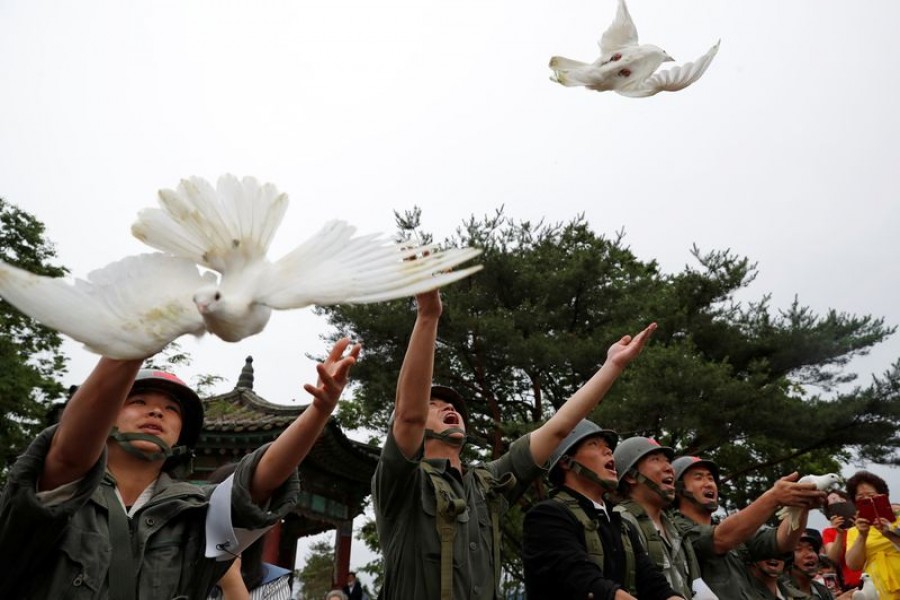 Doves are released during a ceremony commemorating the 70th anniversary of the Korean War, near the demilitarised zone separating the two Koreas, in Cheorwon, South Korea, June 25, 2020. REUTERS/Kim Hong-Ji