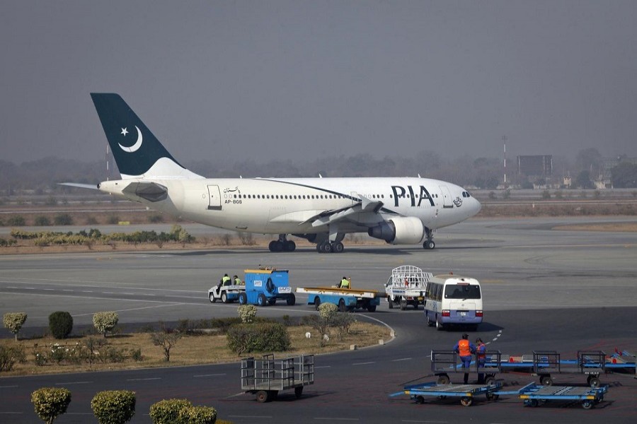 A Pakistan International Airlines (PIA) plane prepares to take off at Alama Iqbal International Airport in Lahore February 01, 2012 — Reuters/Files