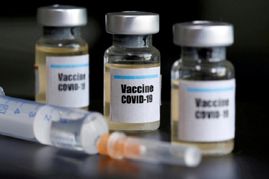 Small bottles labeled with a "Vaccine COVID-19" sticker and a medical syringe are seen in this illustration taken April 10, 2020 — Reuters/Files