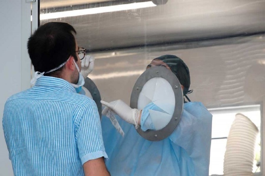 A Mondragone citizen is tested for the coronavirus disease (Covid-19) after 49 people tested positive at a residential complex that was cordoned off after it was placed under quarantine, in the village of Mondragone, northwest of Naples, Italy, June 26, 2020 — Reuters