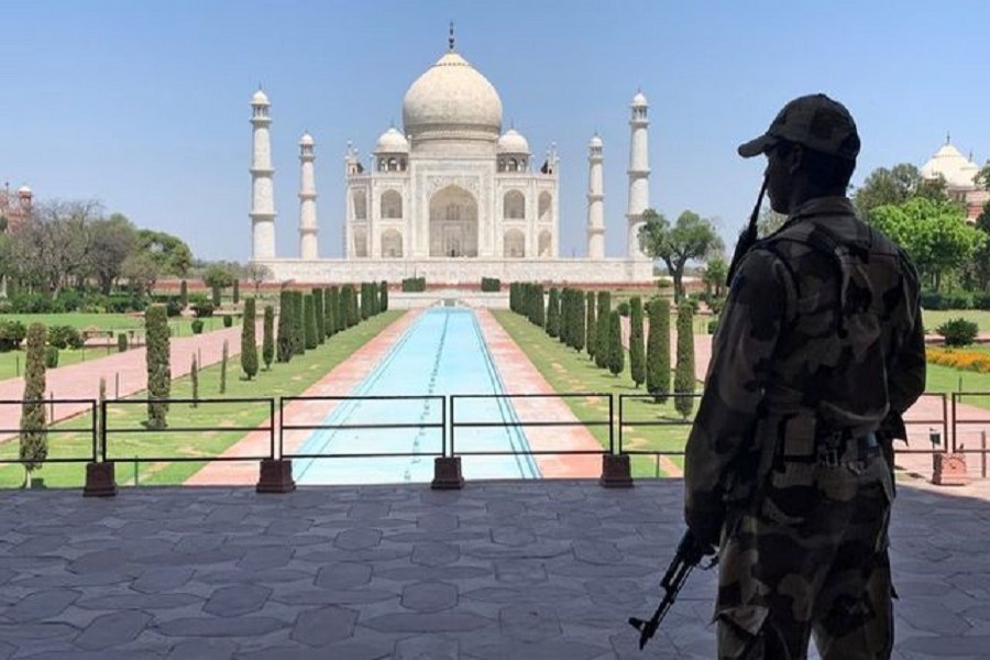 A member of Central Industrial Security Force (CISF) personnel stands guard inside the empty premises of the historic Taj Mahal during a 21-day nationwide lockdown to slow the spread of Covid-19, in Agra, India, April 02, 2020 — Reuters/Files