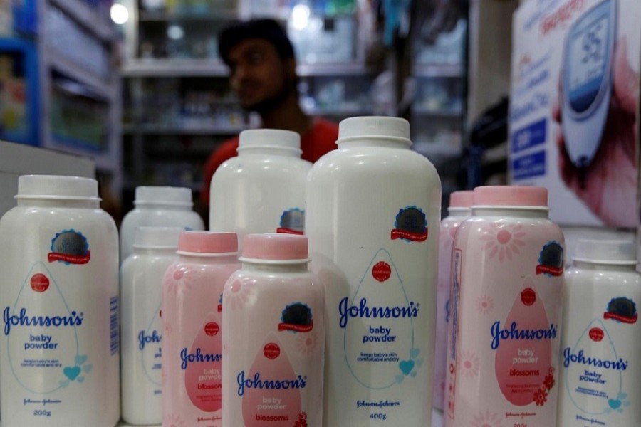 A worker waits for customers as bottles of Johnson & Johnson baby powder are displayed at a medical store in Kolkata, India, December 20, 2018 — Reuters/Files
