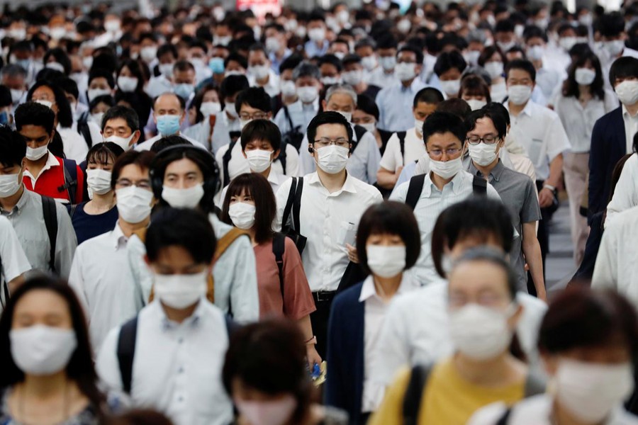 People wearing protective masks amid the coronavirus disease (COVID-19) outbreak, make their way during rush hour at a railway station in Tokyo, Japan on July 3, 2020 — Reuters/Files