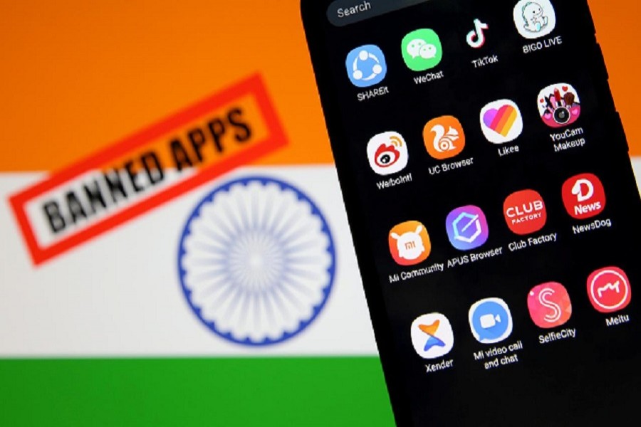 A smartphone with Chinese applications is seen in front of a displayed Indian flag and a "Banned app" sign in this illustration picture taken July 02, 2020 — Reuters/Files