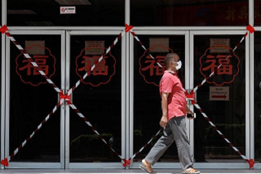 A man passes a closed off mall amid the coronavirus disease (Covid-19) outbreak in Singapore, May 26, 2020 — Reuters/Files