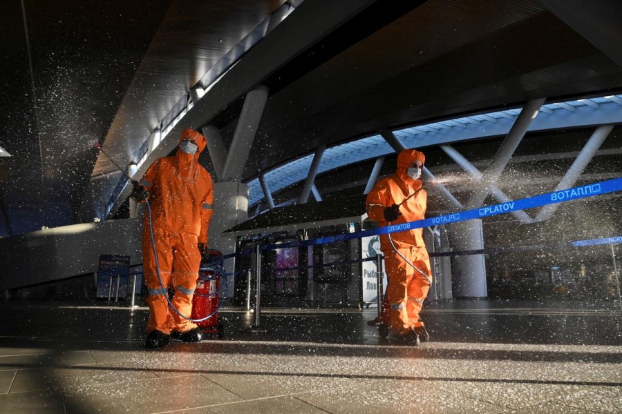 Specialists wearing protective gear spray disinfectant while sanitising Platov International Airport amid the coronavirus disease (Covid-19) outbreak near Rostov-on-Don, Russia on April 15, 2020 — Reuters/Files