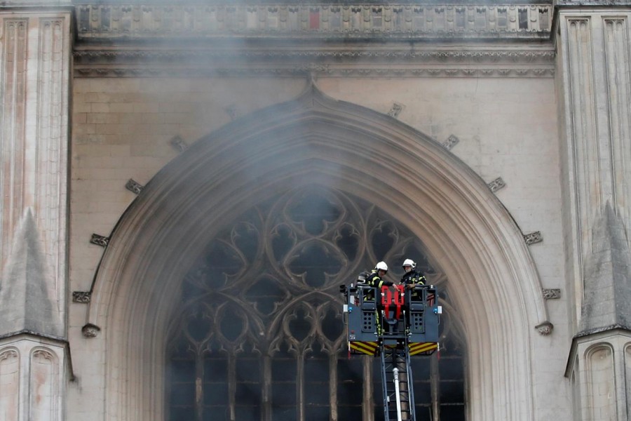 French firefighters battle a blaze at the Cathedral of Saint Pierre and Saint Paul in Nantes, France, July 18, 2020. REUTERS/Stephane Mahe