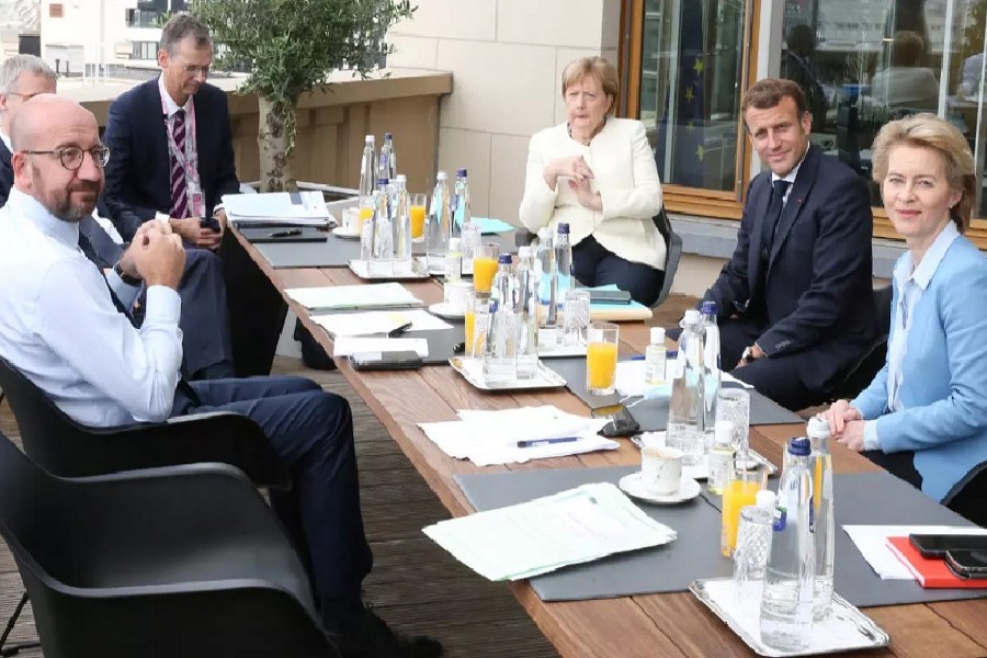President of the European Council Charles Michel (L), Germany's Chancellor Angela Merkel (C), France's President Emmanuel Macron (2nd R) and President of the European Commission Ursula von der Leyen pose during a meeting at the first face-to-face EU summit since the coronavirus disease (Covid-19) outbreak, in Brussels, Belgium, July 19, 2020 — Francois Walschaerts/Pool via Reuters