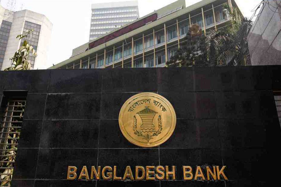 The Bangladesh Bank seal is pictured on the wall outside the central bank headquarters in Motijheel, the bustling commercial hub in capital Dhaka — File Photo