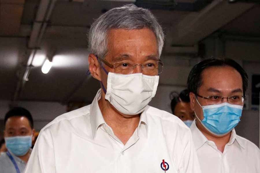 Singapore PM flags delay of step down plan over virus