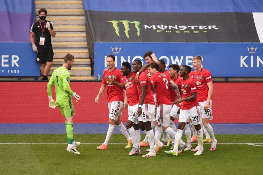 Soccer Football - Premier League - Leicester City v Manchester United - King Power Stadium, Leicester, Britain - July 26, 2020 Manchester United's Jesse Lingard celebrates scoring their second goal with teammates, as play resumes behind closed doors following the outbreak of the coronavirus disease (COVID-19) Pool via REUTERS/Oli Scarff